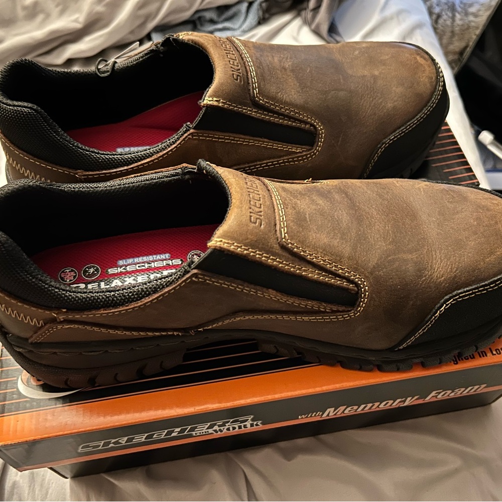 Skechers slip on steel toe work shoes.Size 13